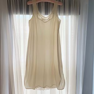 4 for $50.00...Slip, nylon and lace, knee length. White, Size L.